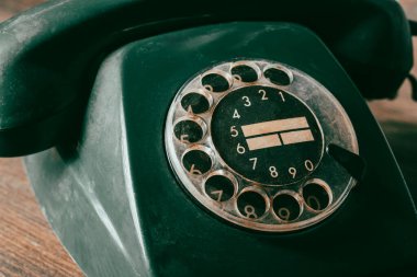 Retro phone with rotary dial. Vintage telephone old style, close up clipart