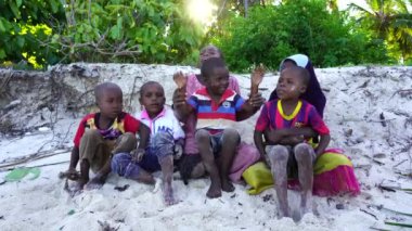 Zanzibar, Tanzania - december 12, 2019 : Young African girl and boy on the tropical beach in island of Zanzibar, Tanzania, east Africa, close up