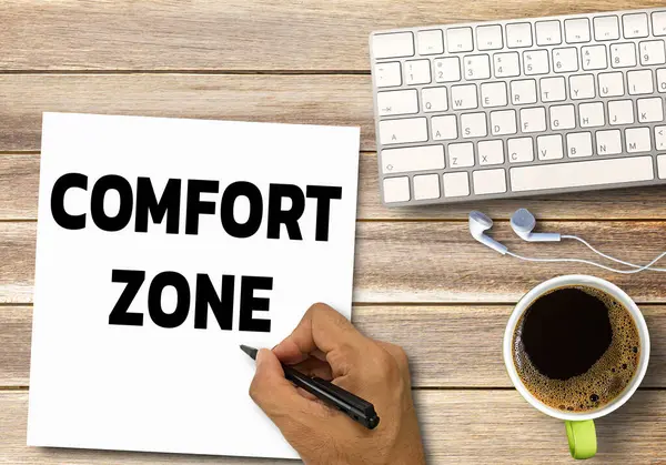 Business quotes, COMFORT ZONE on notebook or paper in office desk, office workplace, inspiration