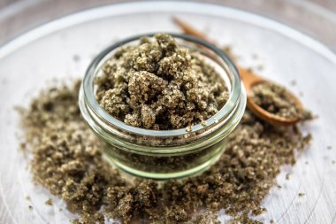 Mint exfoliating scrub (scalp peeling, bath salt, foot soak) with sugar, chopped mint leaves, olive oil and essential mint oil. Healthcare and spa theme