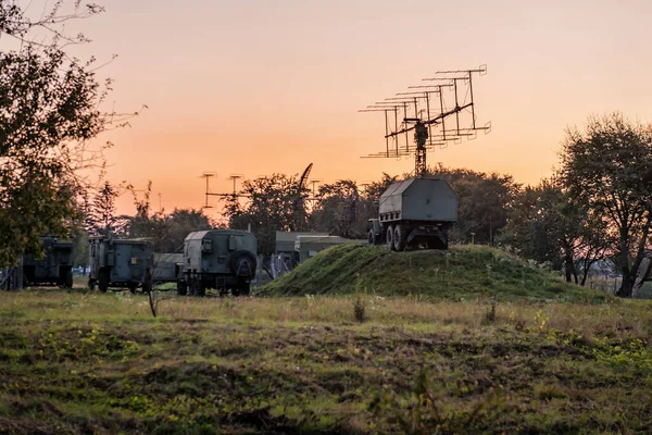Military surveillance radar. Self-propelled integrated radar station. Communication radar. Tactical weapon systems. Car complex with antenna at sunset