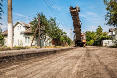 Cold milling machines are used for the quick, highly efficient removal of asphalt and concrete pavements. Removing and grinding the road surface, road construction and road rehabilitation. Industrial theme