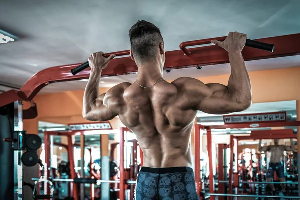 Athlete Muscular Fitness Male Model Pulling Horizontal Bar Gym — Stock Photo, Image