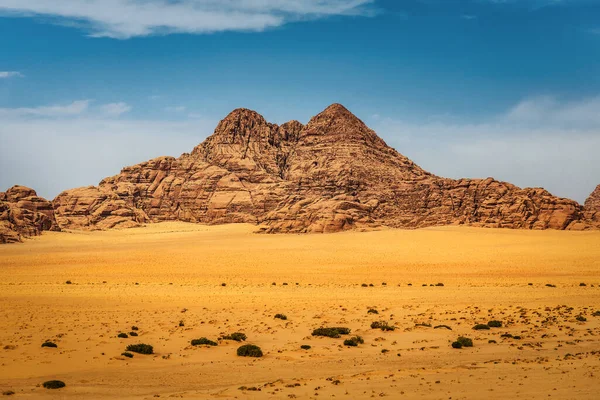 Rocky mountain in desert Wadi Rum or Sahara, Arabian desert. Martian landscape