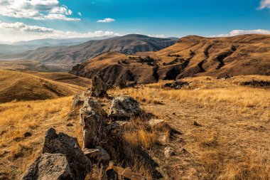 Landscape of Carahunge, prehistoric archaeological site near the town of Sisian, Armenia. Armenian Stonehenge. Travel and vacation theme clipart