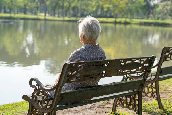 Asian Elderly Woman Depressed Sad Sitting Back Bench Autumn Park — Stock Photo, Image