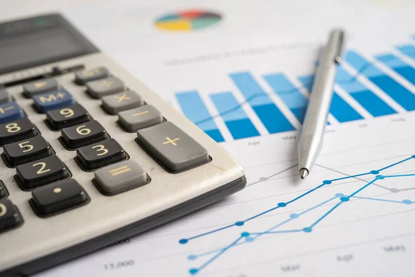 stock image Calculator on chart and graph spreadsheet paper. Finance development, Banking Account, Statistics, Investment Analytic research data economy, Stock exchange trading, Business company concept.