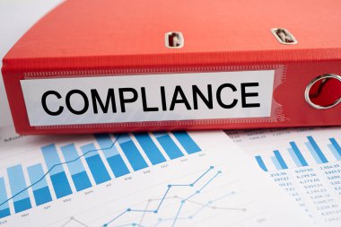 Compliance. Binder data finance report business with graph analysis in office.