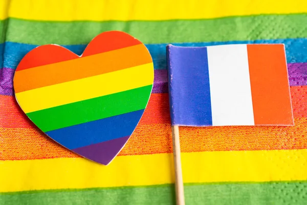 France flag on rainbow background symbol of LGBT gay pride month  social movement rainbow flag is a symbol of lesbian, gay, bisexual, transgender, human rights, tolerance and peace.