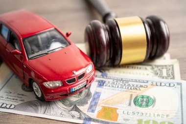 Bangkok, Thailand, January 1, 2023 Hammer gavel judge and money with car vehicle accident, insurance coverage claim lawsuit court case.