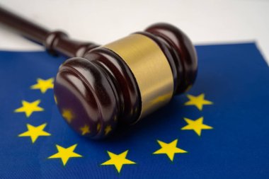 Gavel for judge lawyer on EU flag, finance concept.