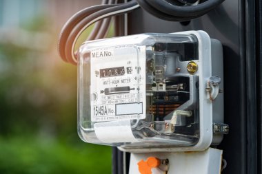 Electric measuring power meter for energy cost at home and office, solar cell concept.