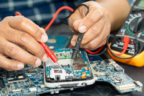 stock image Repairing and upgrade circuit mainboard of notebook, electronic, computer hardware and technology concept.