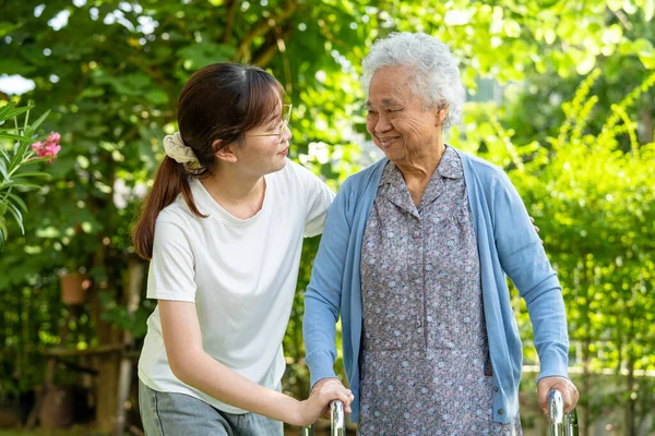 Caregiver Help Asian Elderly Woman Patient Walk Walker Park Healthy — Stock Photo, Image