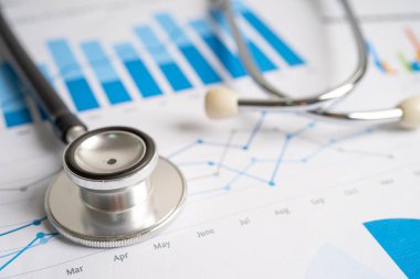 Stethoscope on graph paper, Finance, Account, Statistics, Investment, Analytic research data economy and Business company concept.