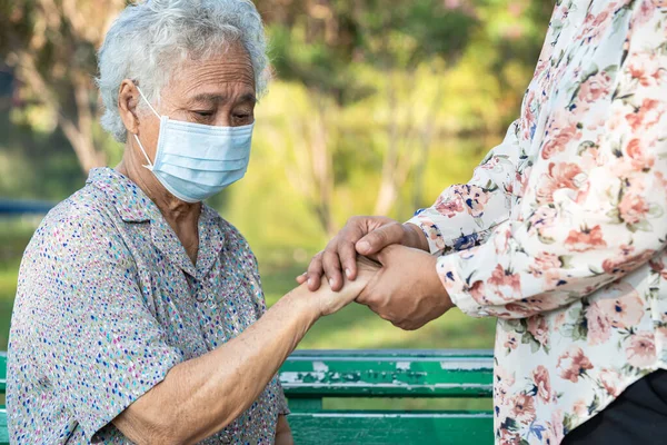 stock image Caregiver holding hands Asian elderly woman patient with love, care, encourage and empathy at nursing hospital, healthy strong medical concept.