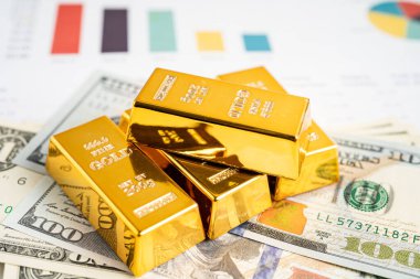 ABD doları üzerindeki altın külçeleri para ve grafik, ekonomi finans ticaret yatırım kavramı.