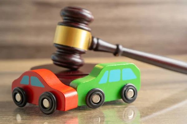 stock image Hammer gavel judge with car vehicle accident, insurance coverage claim lawsuit court case.