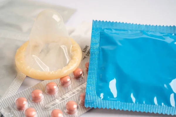 Birth control pills and condom, contraception health and medicine.
