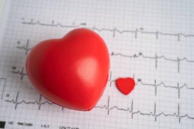 Red heart on electrocardiogram ECG with red heart, heart wave, heart attack, cardiogram report. clipart