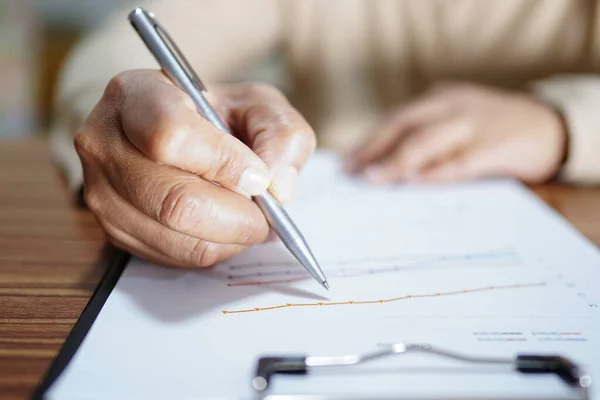 Asian Woman Hand Using Pen Writing Paper While Sitting Table Stock Image