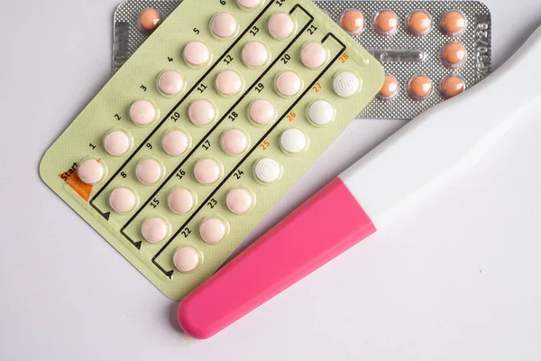 Pregnancy test and birth control pills, contraception health and medicine.