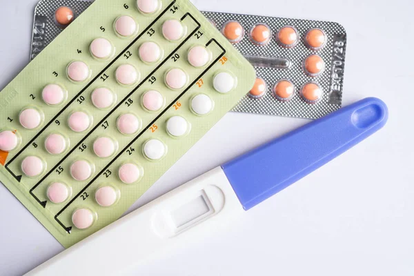 Pregnancy test and birth control pills, contraception health and medicine.