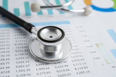 Stethoscope on graph paper, Finance, Account, Statistics, Investment, Analytic research data economy and Business company concept.