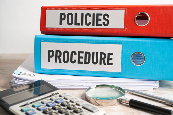 Policies Procedure. Binder data finance report business with graph analysis in office.