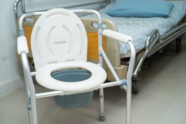 Flush toilet and shower chair in bathroom for old elder people. clipart