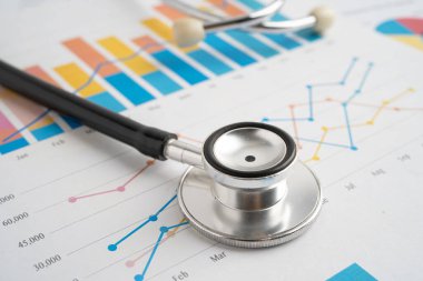 Hesap tablosu ve grafik kağıdına steteskop, Maliye, Hesap, İstatistikler, Yatırım, Analitik araştırma veri ekonomisi ve İş dünyası.