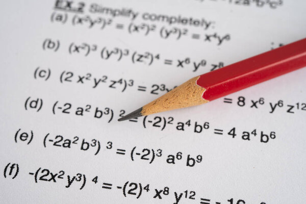 Pencil on mathematic formula exercise test paper in education school.
