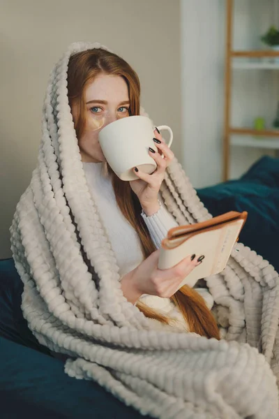 Thoughtful Cozy Woman Drinking Morning Coffee Sitting Sofa Wrapped Blanket — Stock fotografie