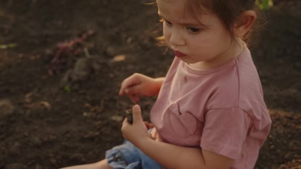 Portrait Little Girl Sitting Garden Cold Ground Morning Looking Her — Stock Video