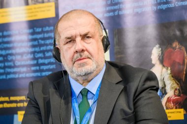 RIGA, LATVIA. 23rd October 2024. Refat Chubarov, at photo.  2nd Chairman of Mejlis of the Crimean Tatar People, during Third Parliamentary Summit, International Crimea Platform. Discussion Deportation of the Crimean Tatar People in 1944. clipart