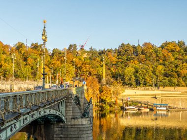 Picturesque autumn colors on the embankment by the Vltava river, Prague, Czech Republic