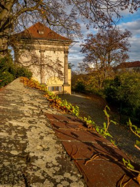 Beautifully colored autumn gardens at Prague Castle with views of St. Vitus or Palace of the Castle. Prague, Czech Republic