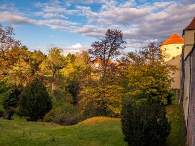 Beautifully colored autumn gardens at Prague Castle with views of St. Vitus or Palace of the Castle. Prague, Czech Republic