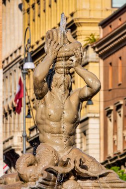  A close-up of the Fontana del Tritone in Rome, depicting the sea god Triton blowing a conch shell, located in Piazza Barberini clipart