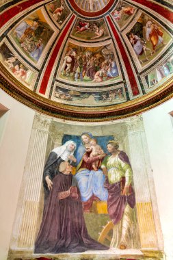 Frescoes by Baldassarre Peruzzi in the Ponzetti Chapel of Santa Maria della Pace, Rome, depict Cardinal Ponzetti with the Virgin Mary, St. Bridget, and St. Catherine. clipart