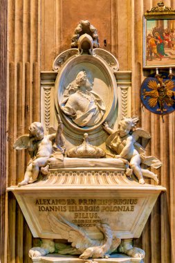 Polonya Prensi Alexander Sobieski 'nin (1714) Santa Maria della Concezione dei Cappuccini, İtalya' da bulunan Kral III. John Sobieski 'nin oğlu mermer mezar. Camillo Rusconi 'nin heykelinde, melekler tarafından çevrelenmiş bir madalyon yer alıyor..