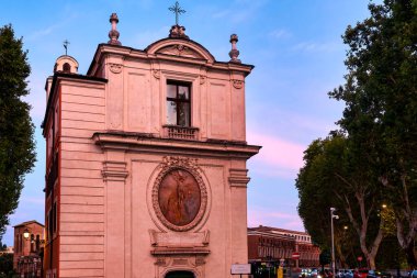 The Baroque facade of Chiesa di San Gregorio della Divina Pieta' at sunset,  Rome, Italy clipart