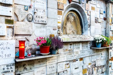 The Madonna degli Orfani is a sacred shrine located on Viale Trastevere in Rome, Italy, featuring a relief of the Madonna in prayer by sculptor Arrigo Minerbi. clipart