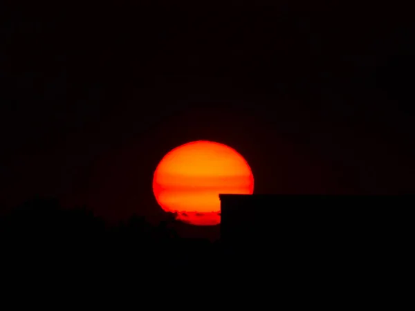 stock image The sunset behind the house