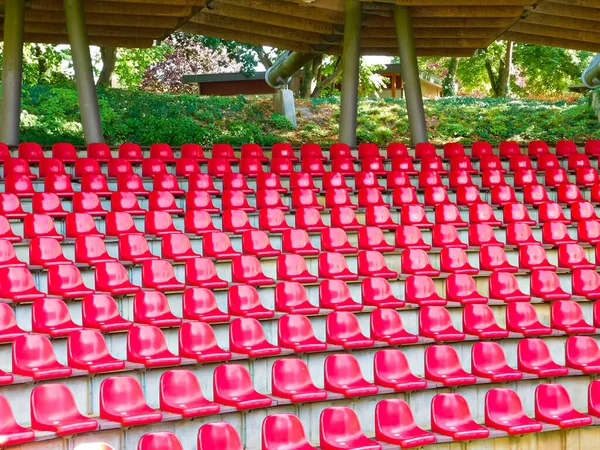 Red seats in the open-air stage