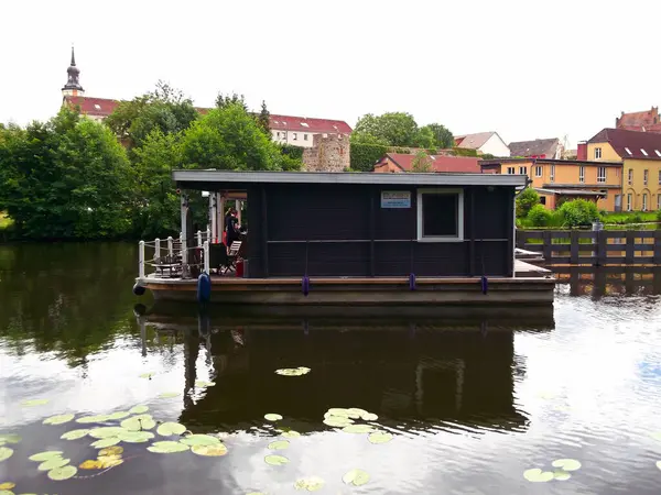 stock image City of Templin in the Uckermark, Brandenburg / Germany - June 17, 2024: With the bungalow boat from BUNBO in front of the city wall