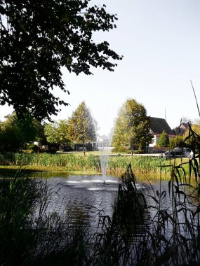 The Sprinbrunnen with its fountain in the pond clipart