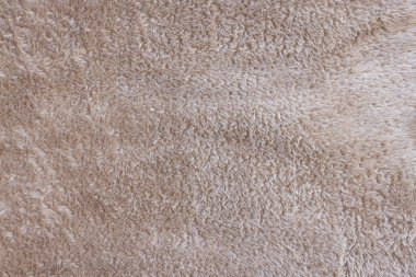 Yeni yumuşak kahverengi battaniye dokusu. Soyut kumaş arka planı. Üst görünüm, kapat