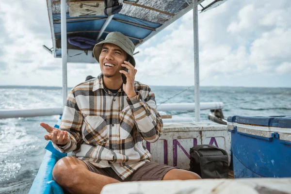 Anglers Chat Cell Phones Break Sitting Fishing Boat Sea — Stockfoto