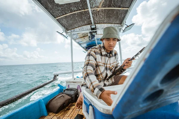 Serious Fisherman Looking Bait Box While Fishing Small Fishing Boat — Stockfoto